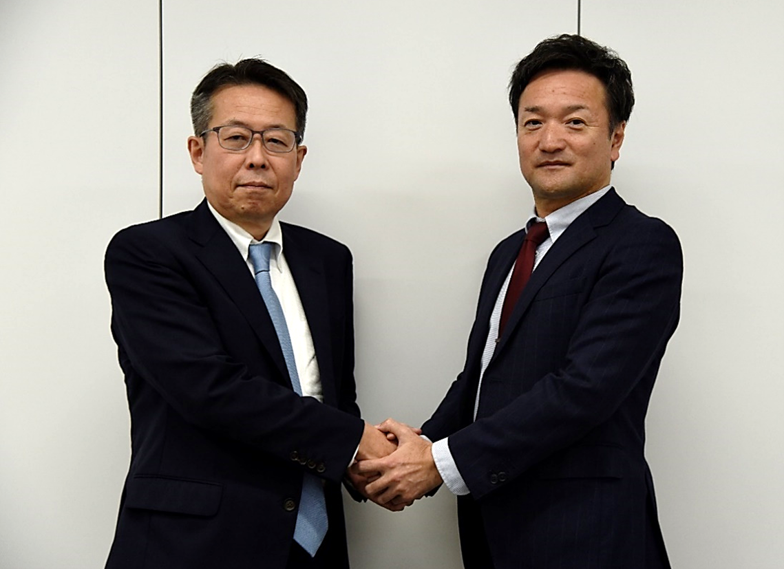 両社代表握手.png